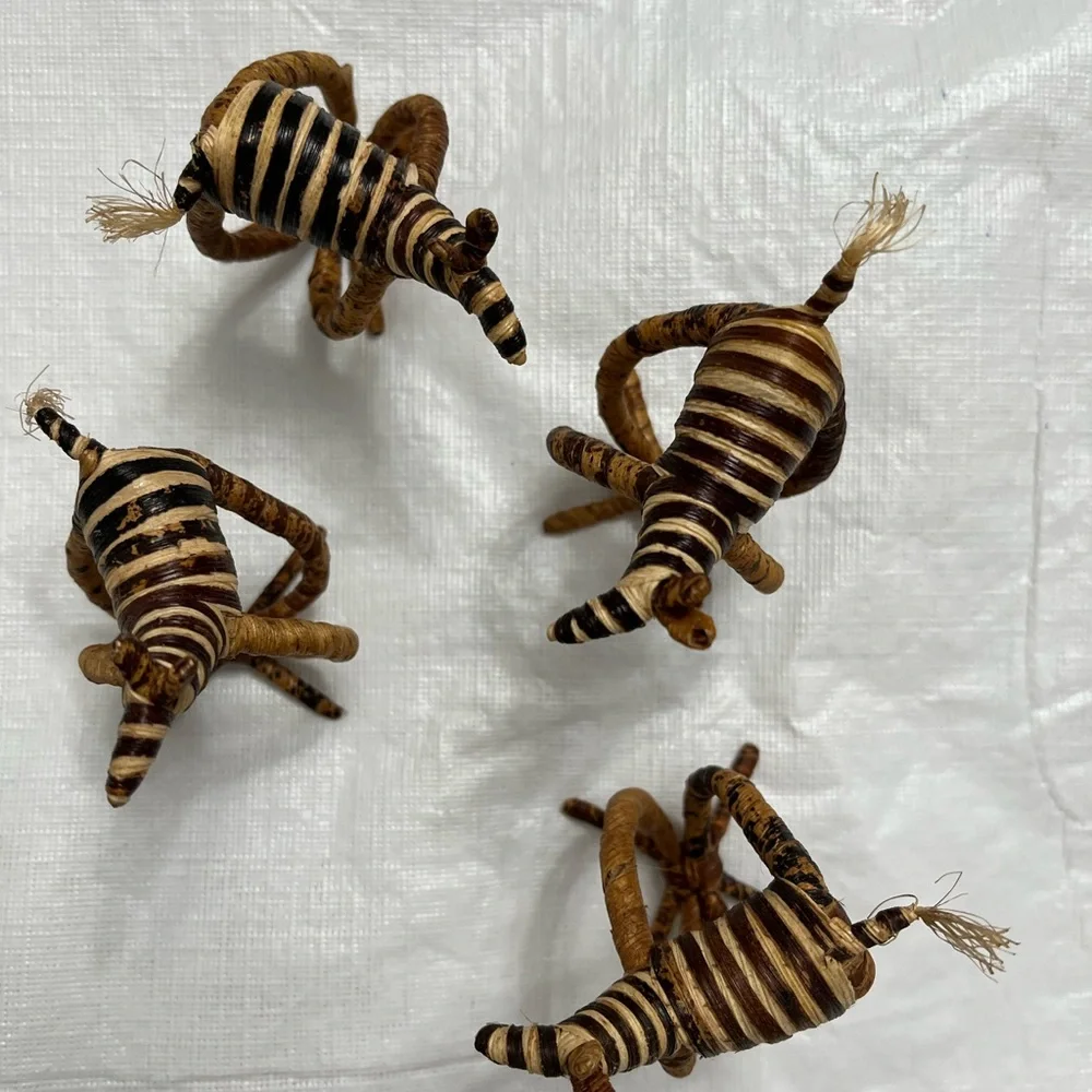 Four hand woven napkin holders